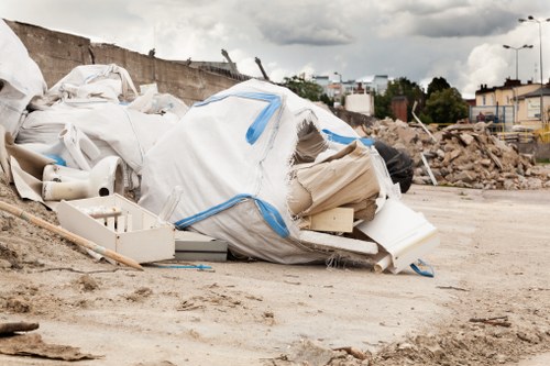Skip Hire Hoxton van outside a terrace property