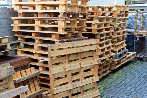 Electric low-emission van parked near a recycling point